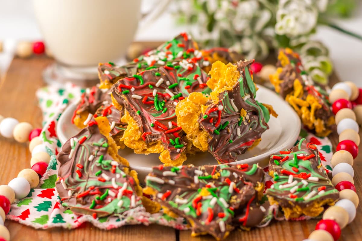 An up close view of Christmas candy on a white plate.