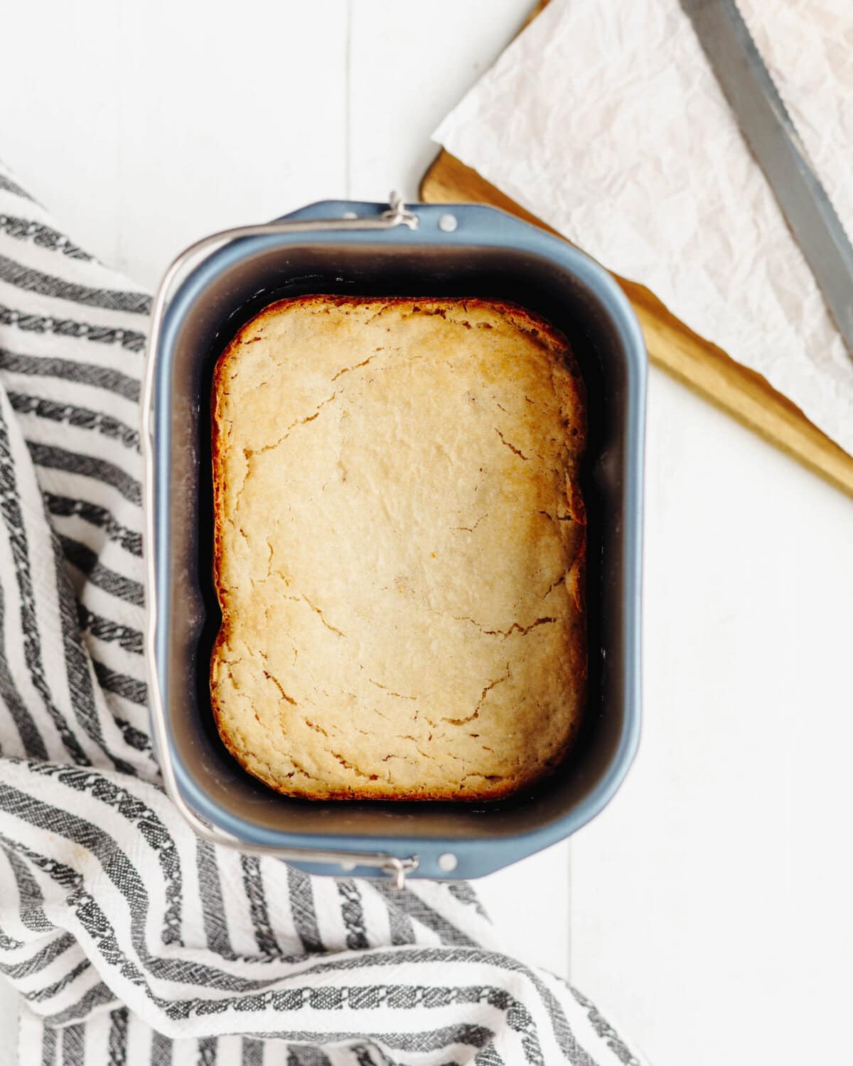 Country white bread cooked in a bread machine pan.