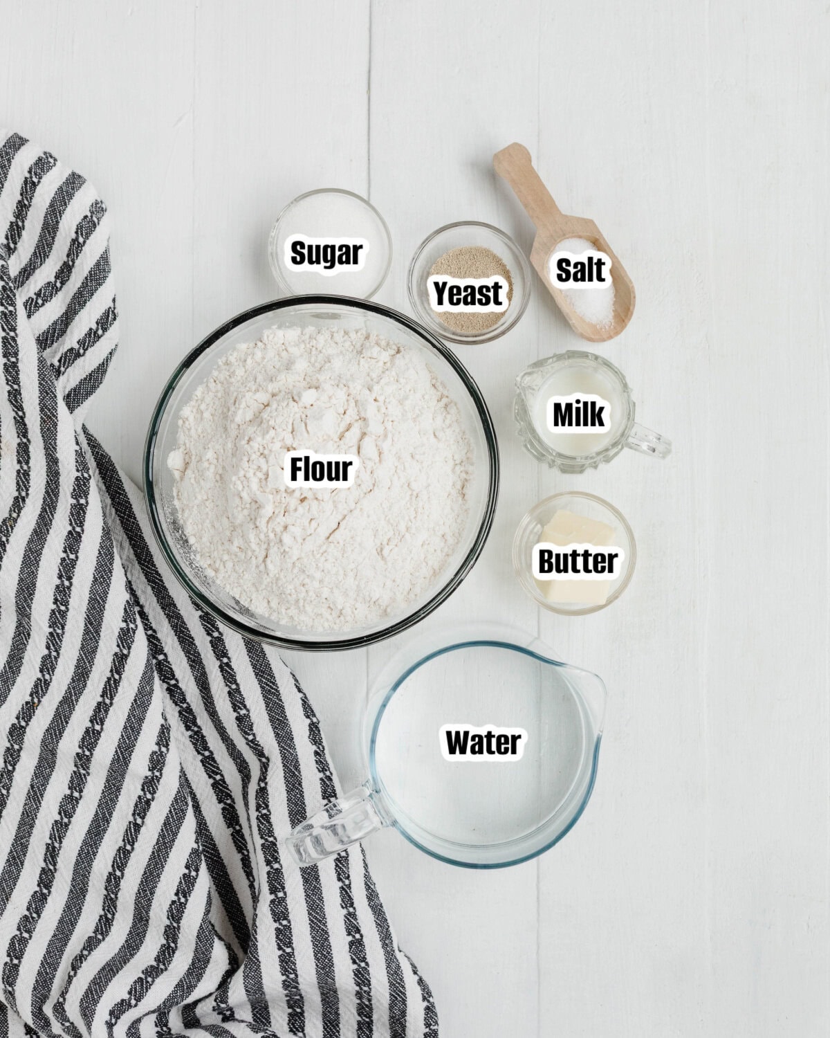 All the ingredients needed to make country white bread.