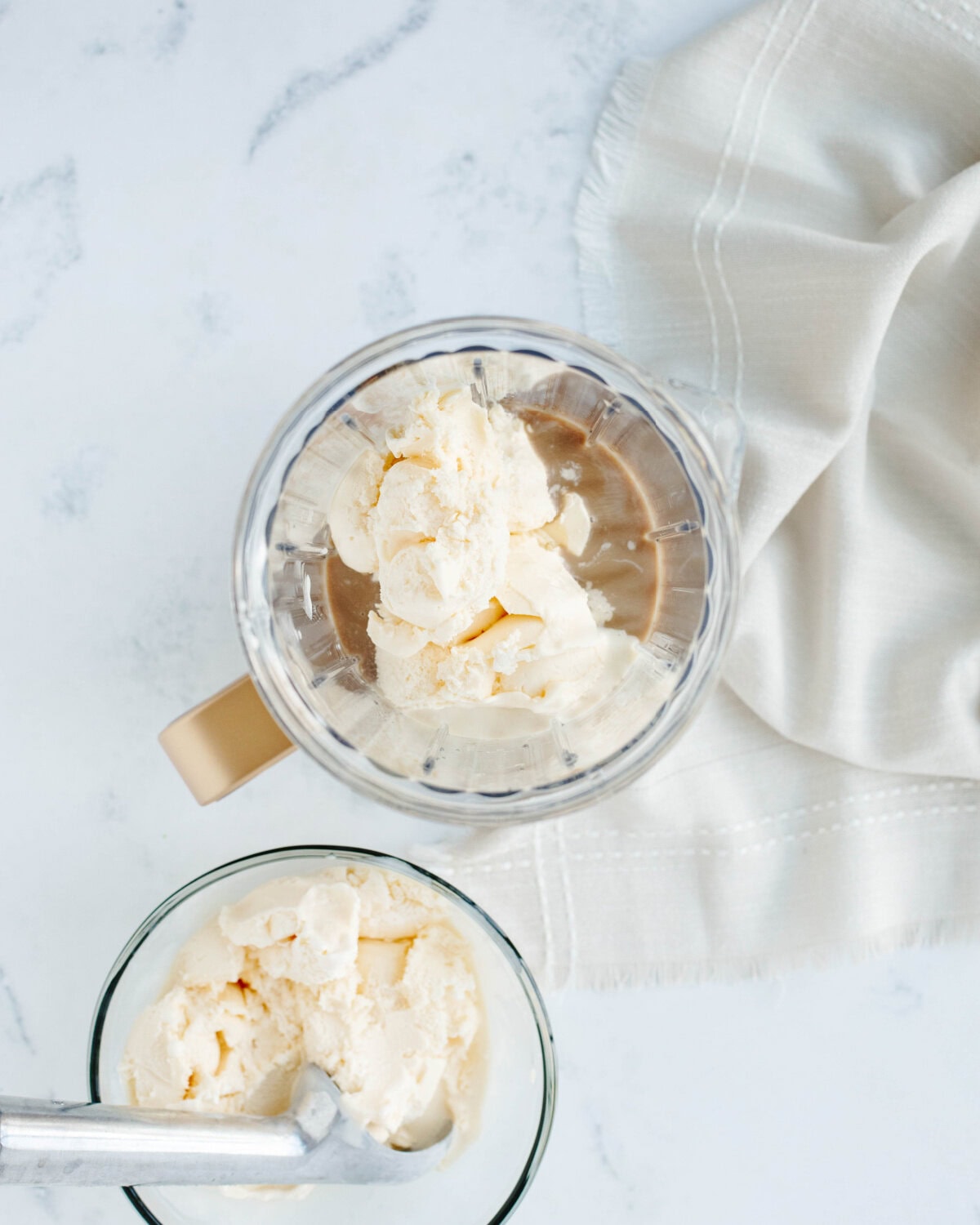 Vanilla ice-cream added to a blender.