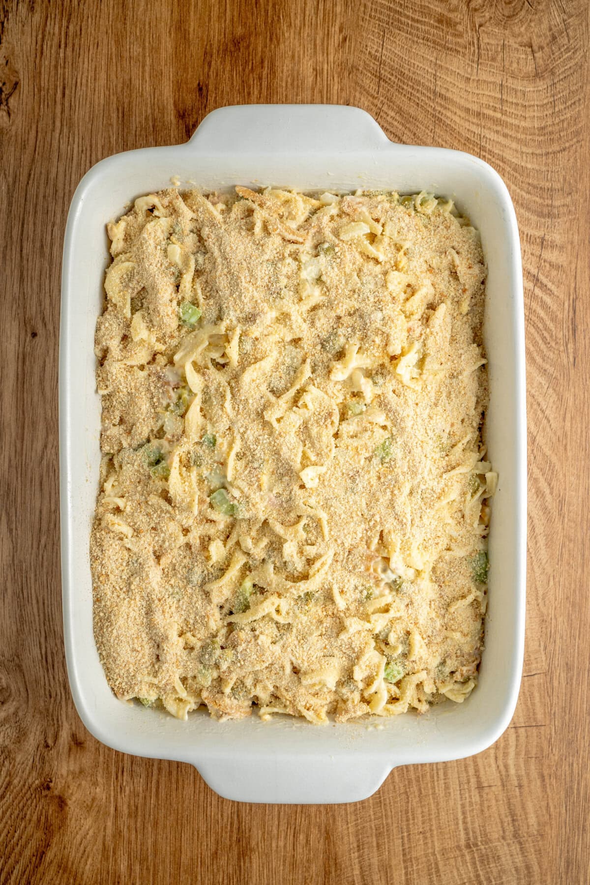 Bread crumbs sprinkled evenly on top of a noodle casserole.